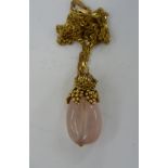 A 9ct gold mounted rose quartz pendant,