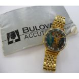 A Bulova gold plated stainless steel cased skeleton bracelet watch,