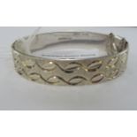 A silver hinged bangle with engraved decoration Birmingham 1973 11