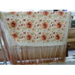 A handmade silk shawl, decorated with flora,