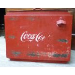 A Coca Cola red painted metal cool box with a hinged lid 15''h 18''w RAB