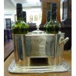 A chromium plated four division wine bottle holder of box design bears an advertising logo for