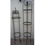 A modern black painted metal garden plant stand,