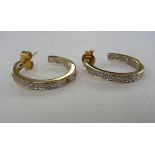 A pair of 9ct gold hoop design earrings,