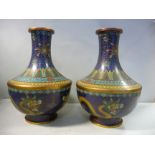 A pair of early 20thC Japanese cloisonne vases of squat, shouldered bottle design,