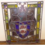 A 19thC Continental stained and painted, leaded glass panel, featuring an armorial,