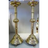 A pair of 19thC Continental ecclesiastical, brass candlesticks,