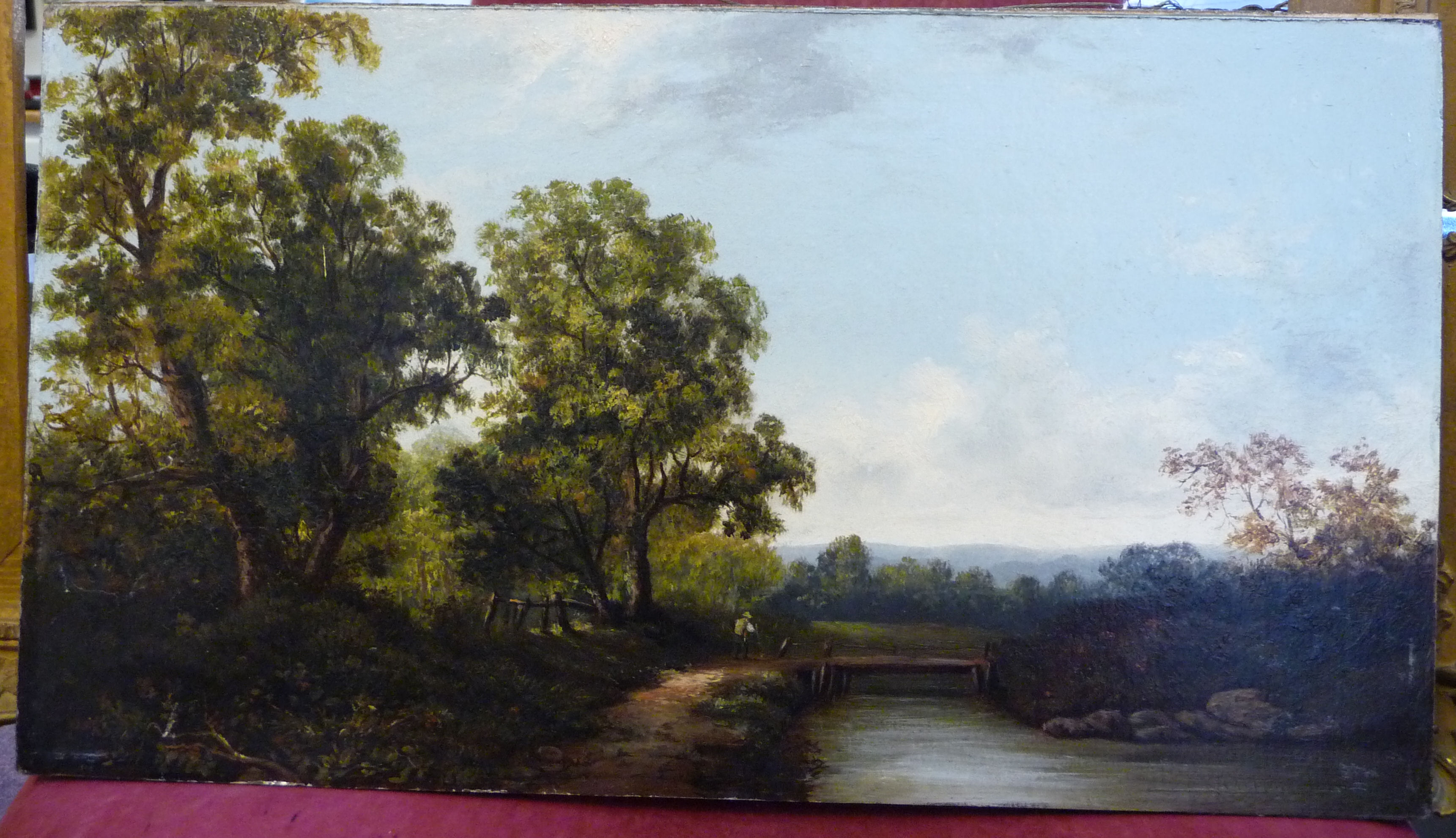 Early 20thC British School - a woodland landscape with a figure by a bridge over a river oil on - Image 2 of 4