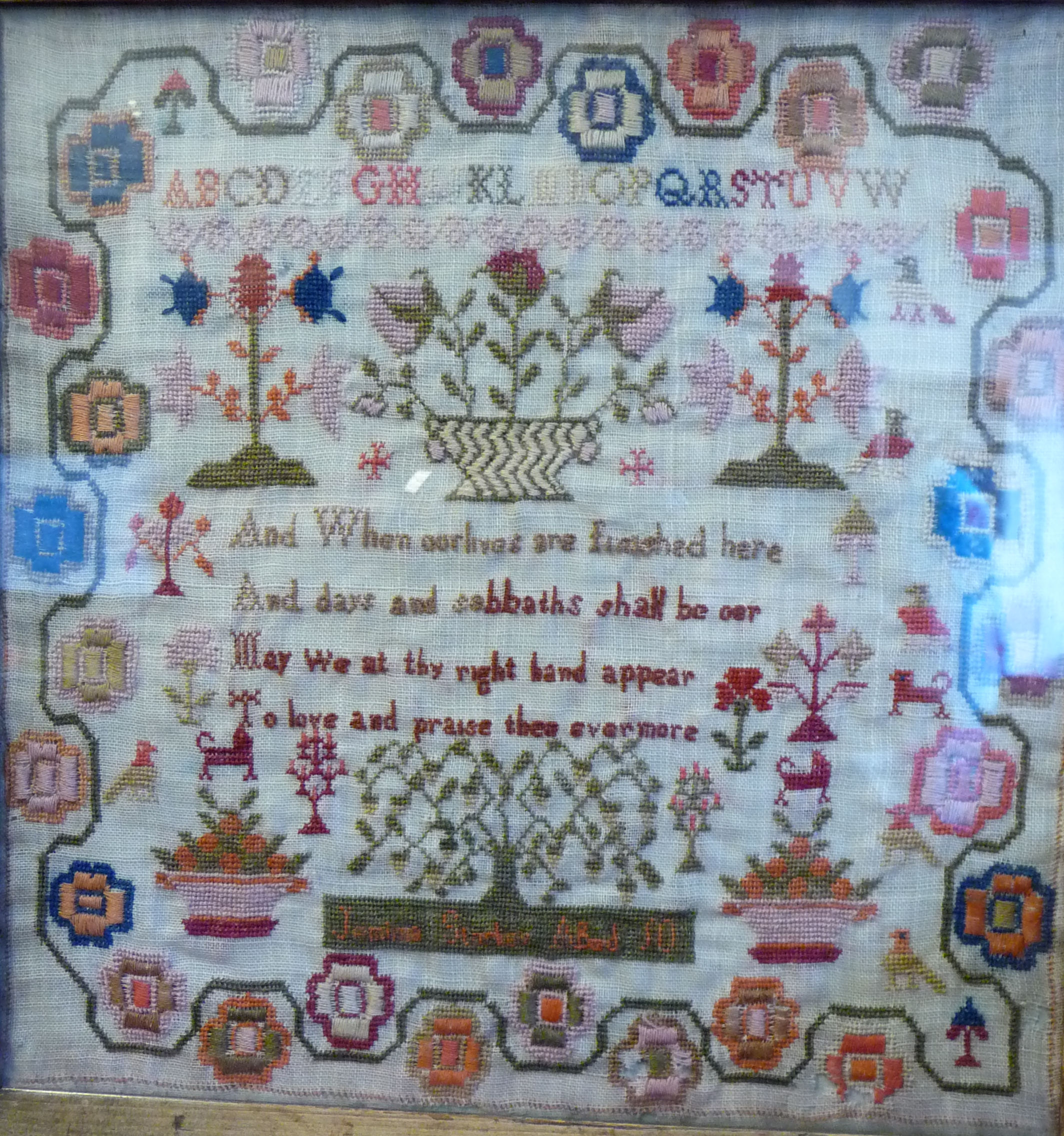 An early 19thC sampler, featuring four lines of text, the alphabet and extensive border ornament, - Image 3 of 10