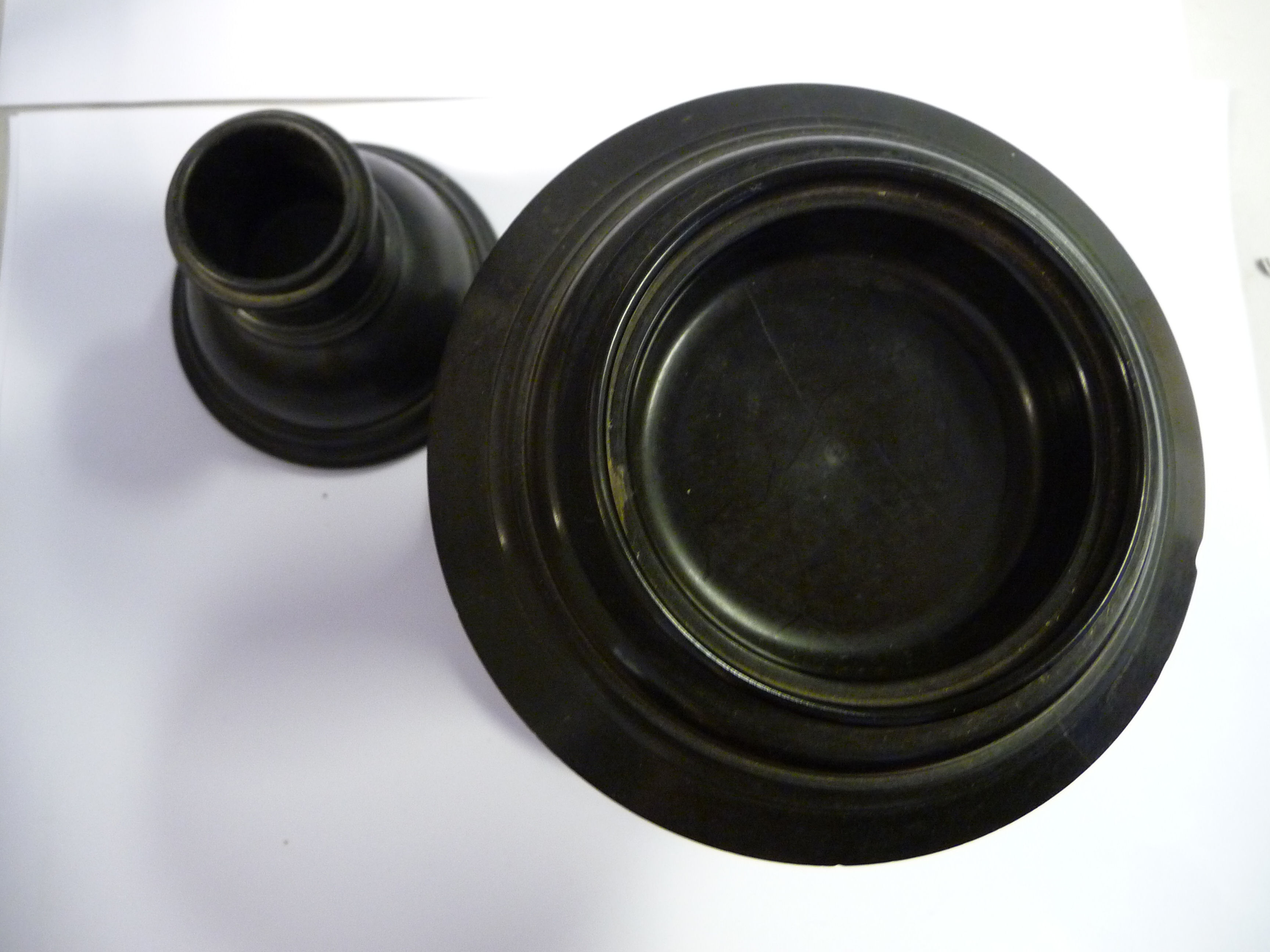 A late 19th/early 20thC black composition three part smoker's companion, comprising a drum base, - Image 3 of 5