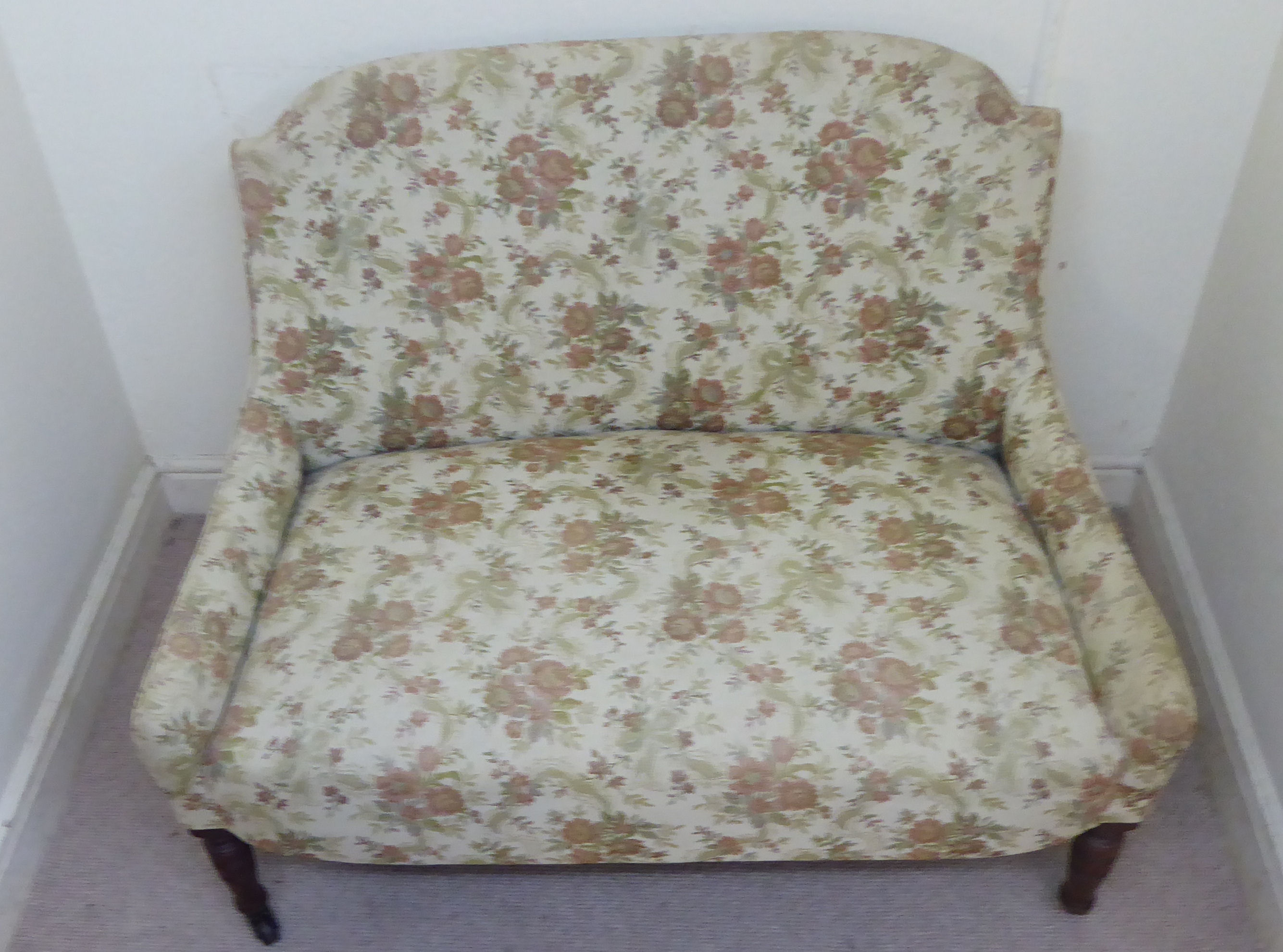 A late Victorian small salon settee, upholstered in a beige coloured, floral fabric, - Image 5 of 8