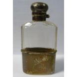 A late Victorian facet cut glass hip flask of shouldered form with an applied silver collar,