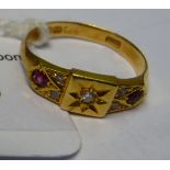 A late Victorian 18ct gold diamond and ruby set ring