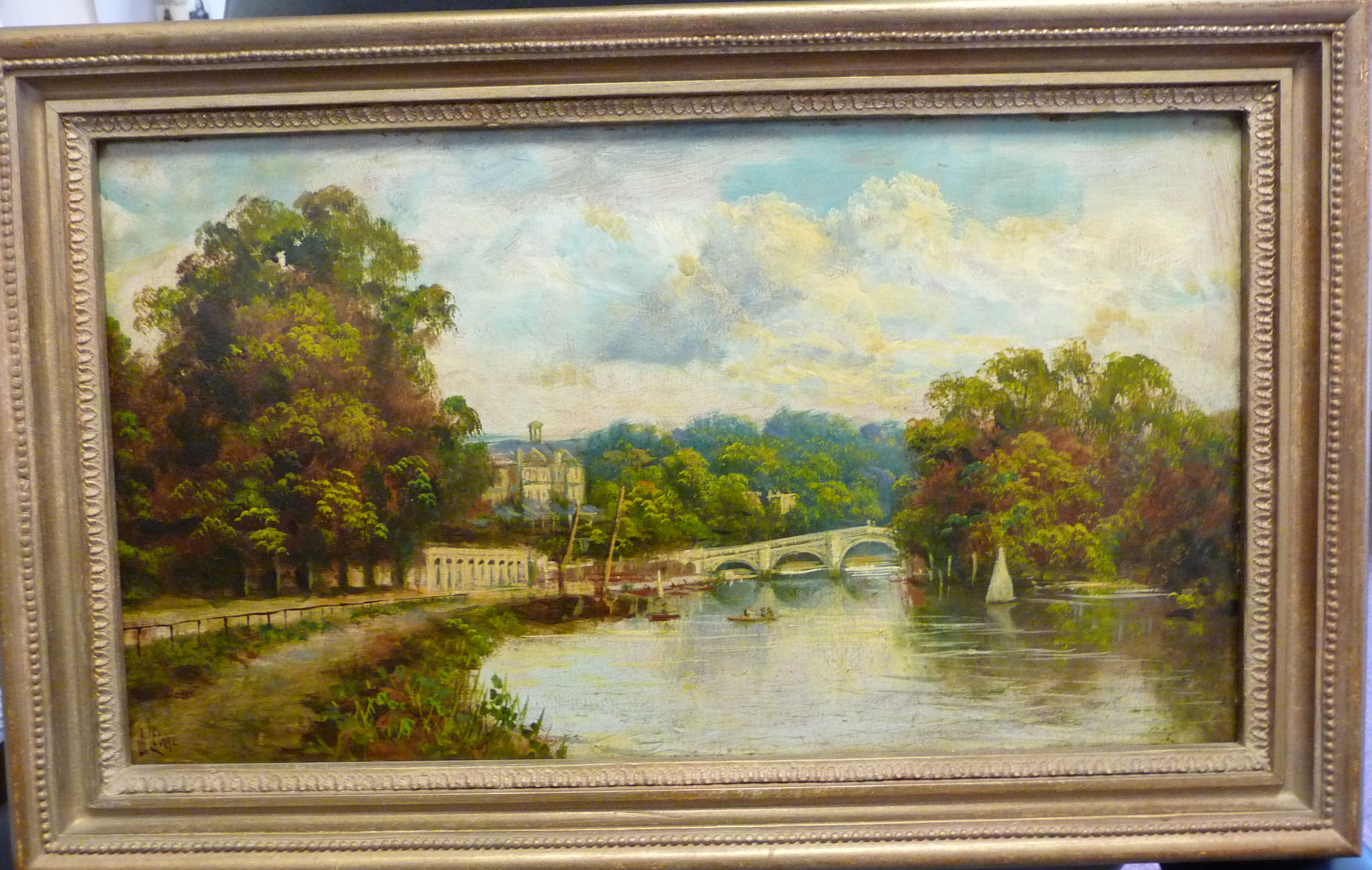 J Lewis - 'The Thames at Richmond' with small sailing boats and other moored craft oil on board