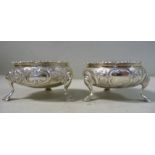 A pair of George III silver ogee shaped, circular salt cellars,