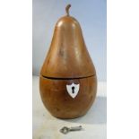 A 20thC turned and carved fruitwood tea caddy, in the form of a pear with a lockable, hinged lid 7.