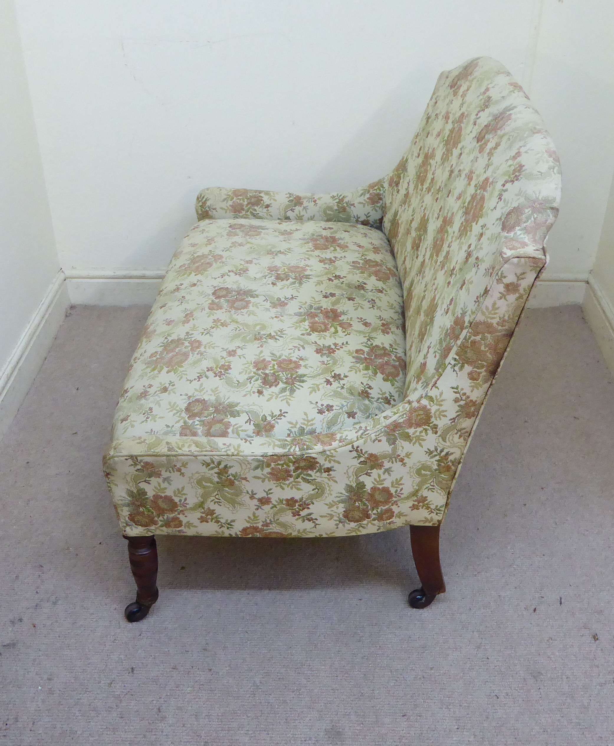 A late Victorian small salon settee, upholstered in a beige coloured, floral fabric, - Image 8 of 8