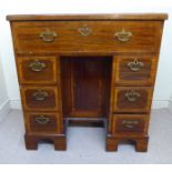 A George III satinwood inlaid mahogany kneehole writing desk with a crossbanded top,