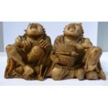 An 18th/19thC Chinese carved light brown soapstone group, two seated corpulent fishermen,