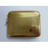 A 1920s 9ct gold vesta case of rectangular form with Greek key and other engine turned ornament,