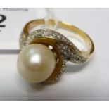 A 9ct gold pearl and diamond cluster ring