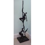 A modern cast and patinated bronze sculpture,