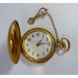 A lady's 14ct textured gold cased full hunter fob watch, on a pendant ring,