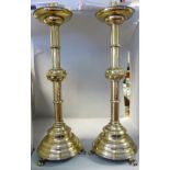 A pair of 19thC Continental ecclesiastical, brass candlesticks,