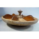 A late 19thC Continental turned pine spice dispenser, the shallow bowl with six divisions,