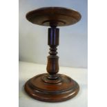 A late 18thC turned walnut candlestand with a rotating top, on a vase and ring knopped stem 7.