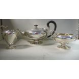 An Empire style silver three piece tea set comprising a teapot of pedestal bowl design with a cast