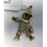 A 9ct gold pendant, fashioned as a clown with mobile limbs,
