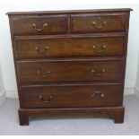 A George III mahogany crossbanded oak dressing chest, the top with a moulded edge,