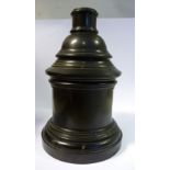 A late 19th/early 20thC black composition three part smoker's companion, comprising a drum base,