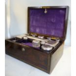 An early Victorian rosewood veneered and lacquered brass string inlaid vanity box with straight