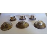 A set of three silver novelty 'top hat' design menu holders with a set of three, textured, silver,