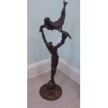 A modern cast and patinated bronze sculpture,