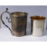 An early 20thC Continental spot-hammered silver coloured metal tankard of straight sided form with