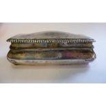 A late Victorian silver box of ogee casket form with a hinged lid and gilded interior H Matthews