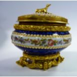 An early 20thC Continental cast gilt metal, midnight blue enamel and floral decorated oval ring box,