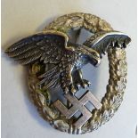 A Luftwaffe pilot's badge on a brooch pin stamped C.E.