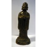 A 17th/18thC Chinese cast bronze figure, a robed, standing deity, on a domed plinth 7.
