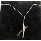 A 9ct white gold necklace of cross design, set with graduated diamonds,