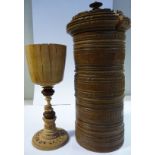 A 19thC Continental carved and machine turned boxwood tower design wood turner's compendium,