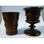 An early 19thC turned, one-piece fruitwood pedestal vase design egg cup; and a contemporary turned,
