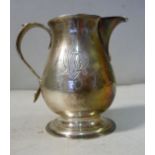 A George II silver sparrow beak cream jug with a scrolled handle,