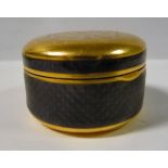 A Continental 18ct gold circular snuff box with aubergine coloured,