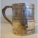 A George III silver Christening mug of straight sided form with a hollow loop handle and simple