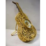 A late 19thC novelty timepiece, the gilt metal case in the form of a cello,