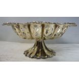 An Edwardian silver basket with uniformly pierced, lobed sides and a pressed foliate scrolled,